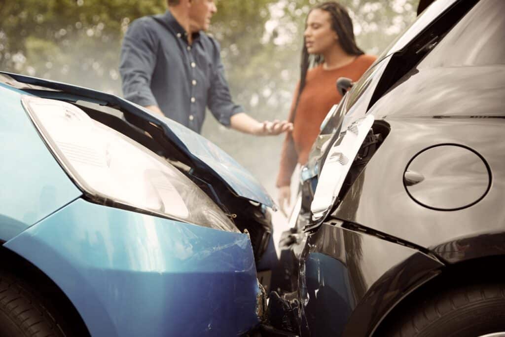 Two Angry Motorists Arguing Over Responsibility For Car Accident